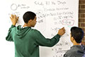 students at white board (image - Mike Siegel, Seattle Times)