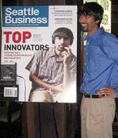 photo, Shwetak Patel next to his own picture on cover of Seattle Business magazine