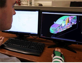 ME student designing car on computer. Credit: Seattle Times