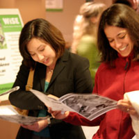 young women eating salads and talking