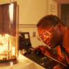 Professor Sam Jenekhe examines an apparatus in the lab