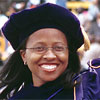 happy graduate in purple robes