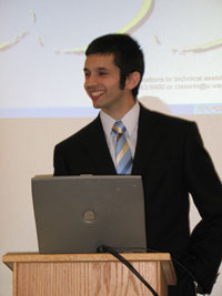 REU student presenting at podium