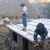 workers fixing roof