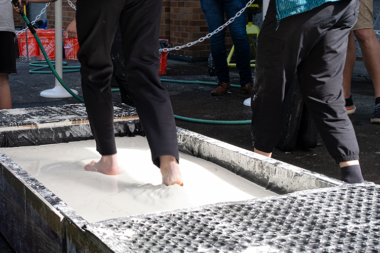 Young student trying out exhibitor booth experience