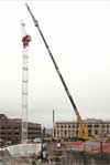 The tower crane in place with the operator cab on top. (Photo by John Stamets)