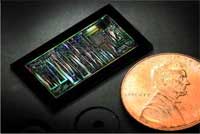 silicon chip next to a penny