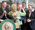 Gov. Chris Gregoire hugs Microsoft's Brad Smith.