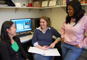 New HCDE Assistant Professor Julie Kientz (center) meets with graduate students Dawn Sakaguchi (left) and Sajanee Halko.