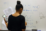 student working at whiteboard