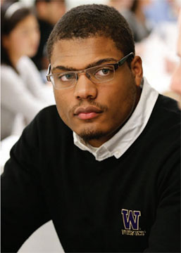 African-American man in Huskies sweater