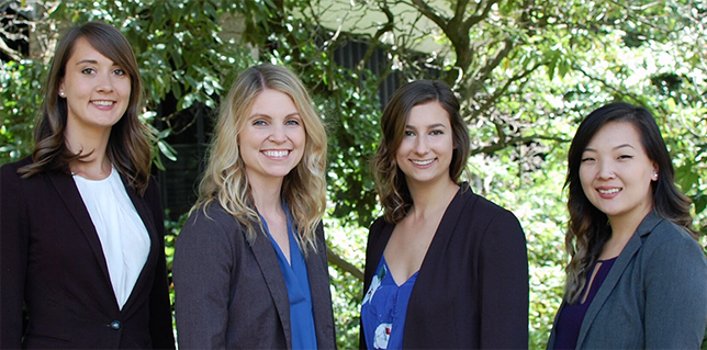 four smiling CoE academic advisers outdoors