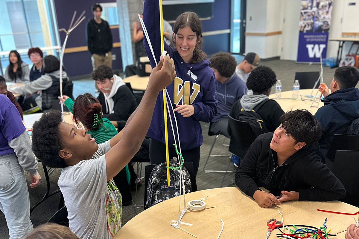 Engineering ambassadors performing demonstration in classroom