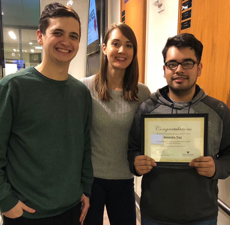 From 2017-2018, Lead EPE Sam Najmolhoda, Lauren Fryhle, Lead Academic Adviser, and Alejandro Diaz, Outstanding EPE award