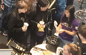 two women looking at brochure at Engineering Societies Fair