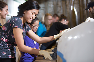 women CEE students working on a project