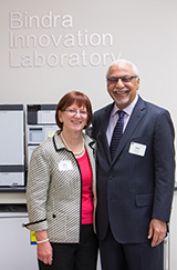 Jeet and Jan Bindra, standing in front of the Bindra Innovation Laboratory