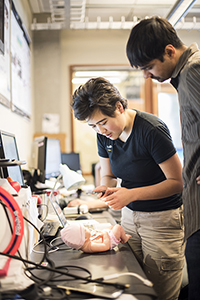 Researchers interacting with computer