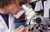 student at microscope student at microscope