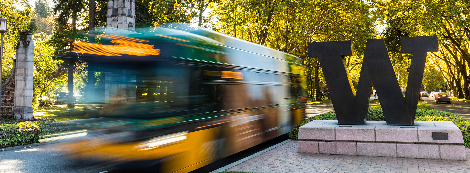 Bus passing by W sculpture