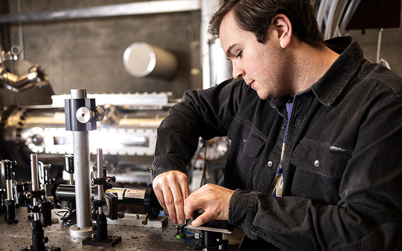 Person tinkering with machine