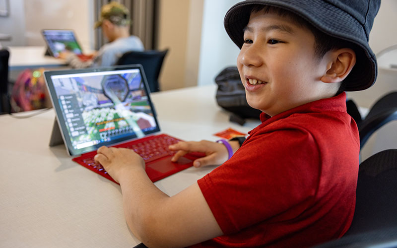Discovery Days visitor working on coding exercise