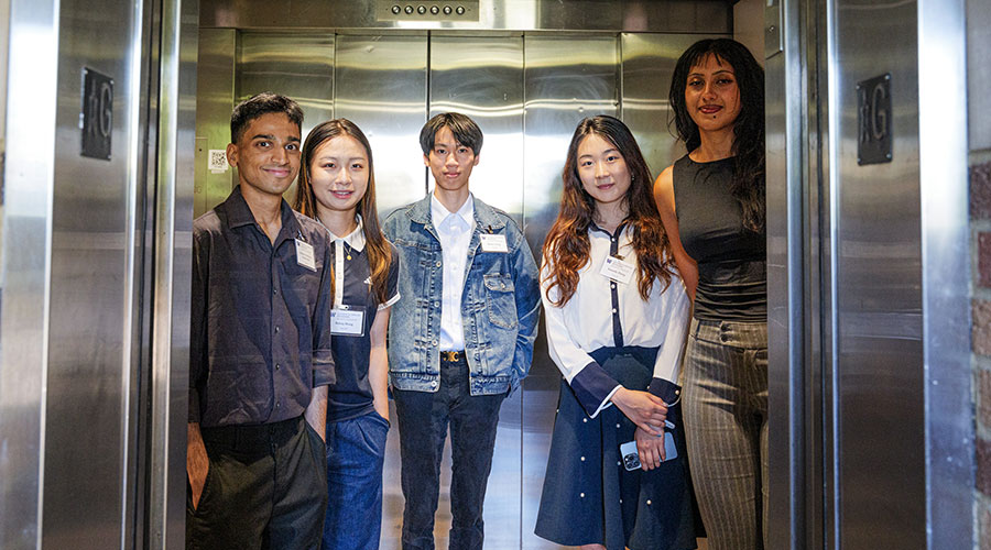 Students standing inside elevator
