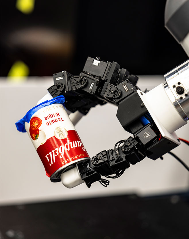 Robot holding on to can