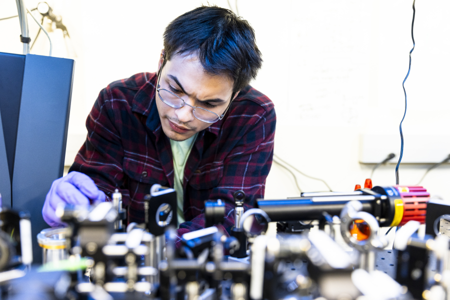 Man in a lab working in a machine