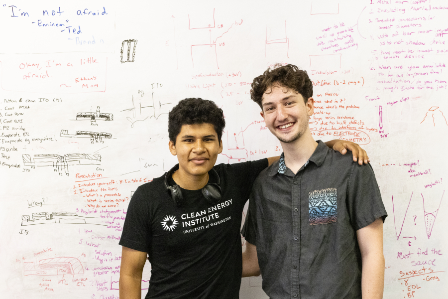 Two men smiling at the camera