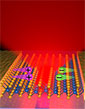 graphical representation showing the layers of the 2-D LED and how it emits light