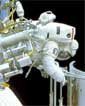 astronaut and camera at Hubble in 1994 - courtesy NASA