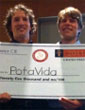 excerpt of photo showing PotaVida team holding up an oversize check