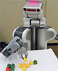 robot arranges colored blocks