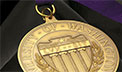 photo of medal received by UW Awards of Excellence honorees