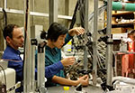 Professor Uri Shumlak and student Bonghan Kim work on a Z-pinch prototype.