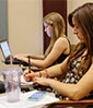 two female students in a programming class