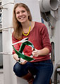 ME student holds a turbine prototype