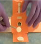 gloved hands prepare the origami paper lab test