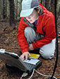 Susan Dickerson-Lange measures snow levels in PNW forests