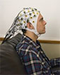UW students Darby Losey with electroencephalography cap
