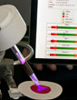 plasma pen touching a blood sample and displaying the results on a mobile device
