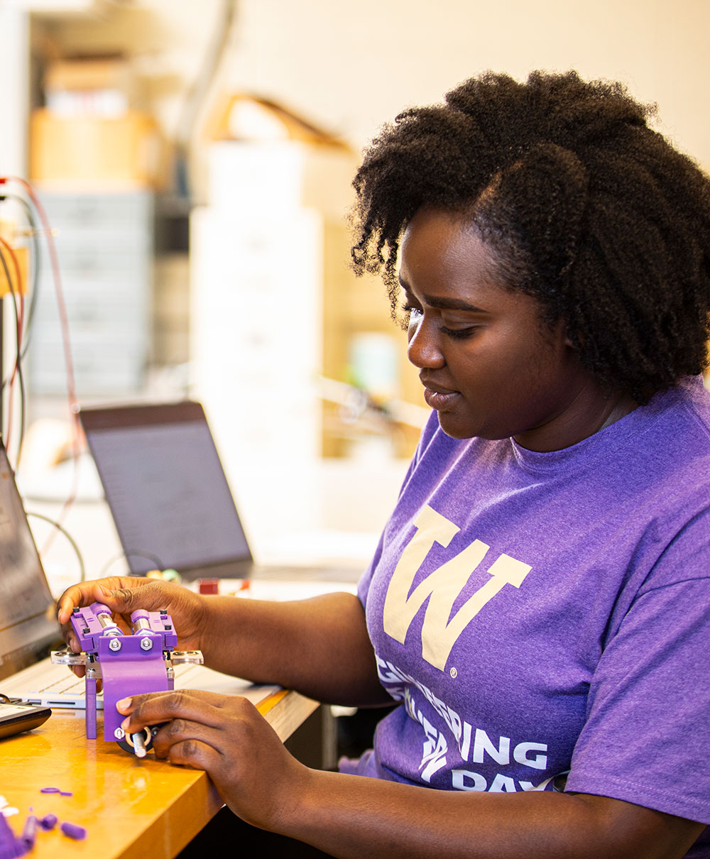 Student working on a prototype in a lab