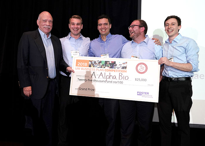 photo of group holding a big check