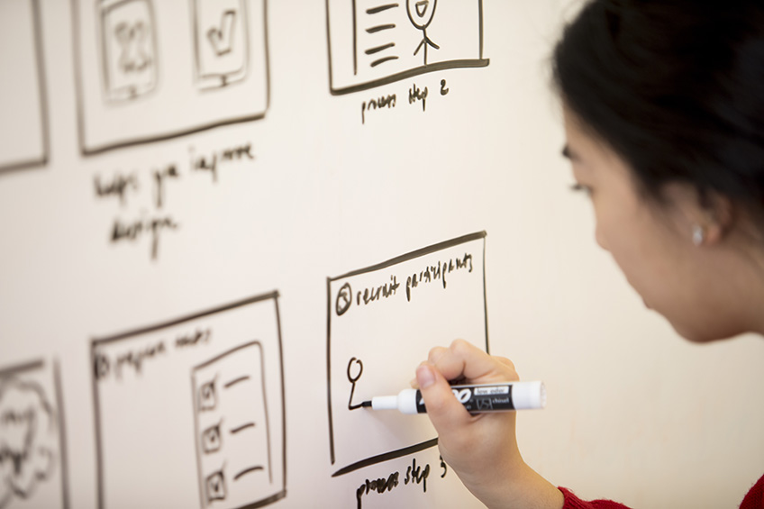 picture of student writing on white board