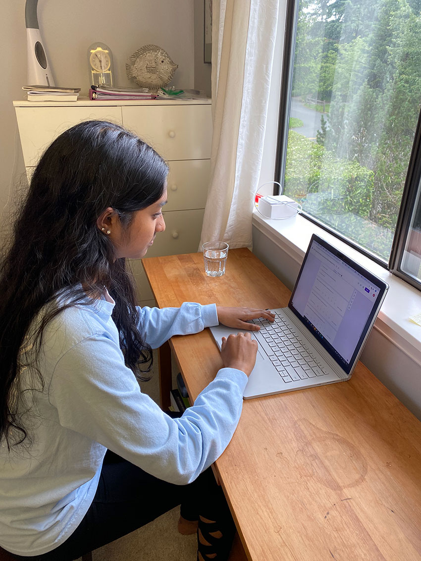 Female student working on a laptop