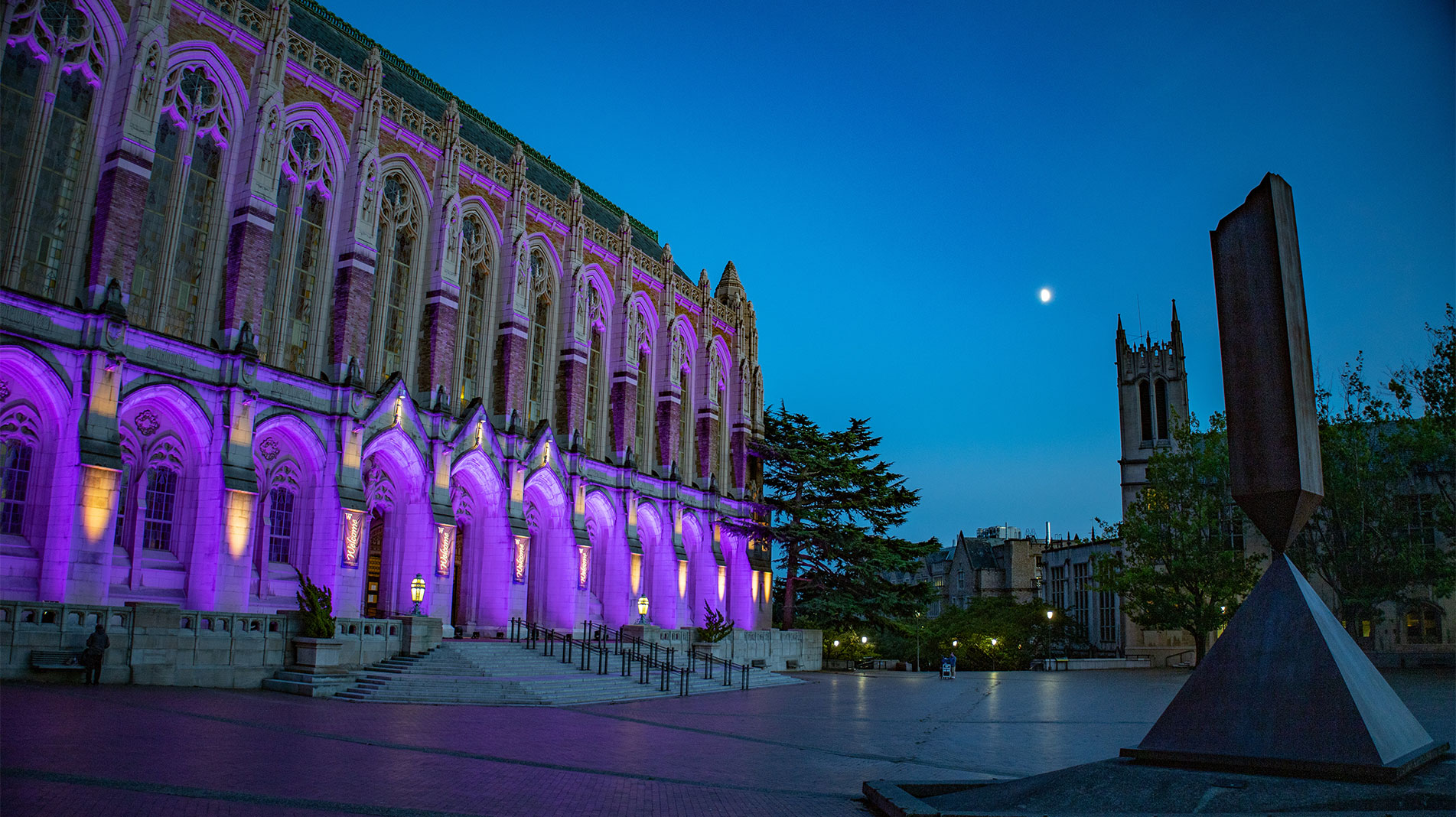 UW building lit up purple at night
