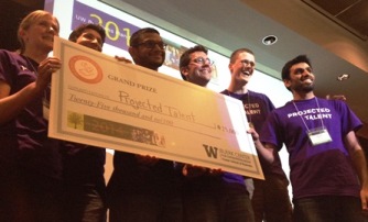 Projected Talent team holding an oversized check for $25k