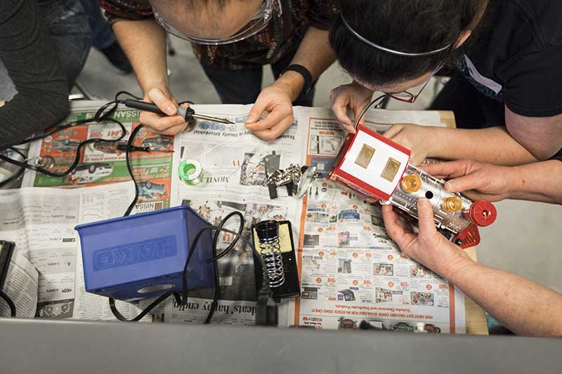 photo from above of students soldering