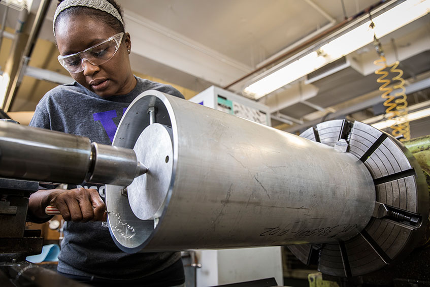 Igbinosun working with a lathe